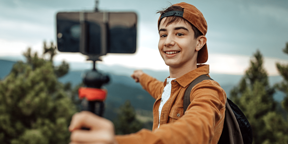 Picture of a r influencer smiling with a camera doing a